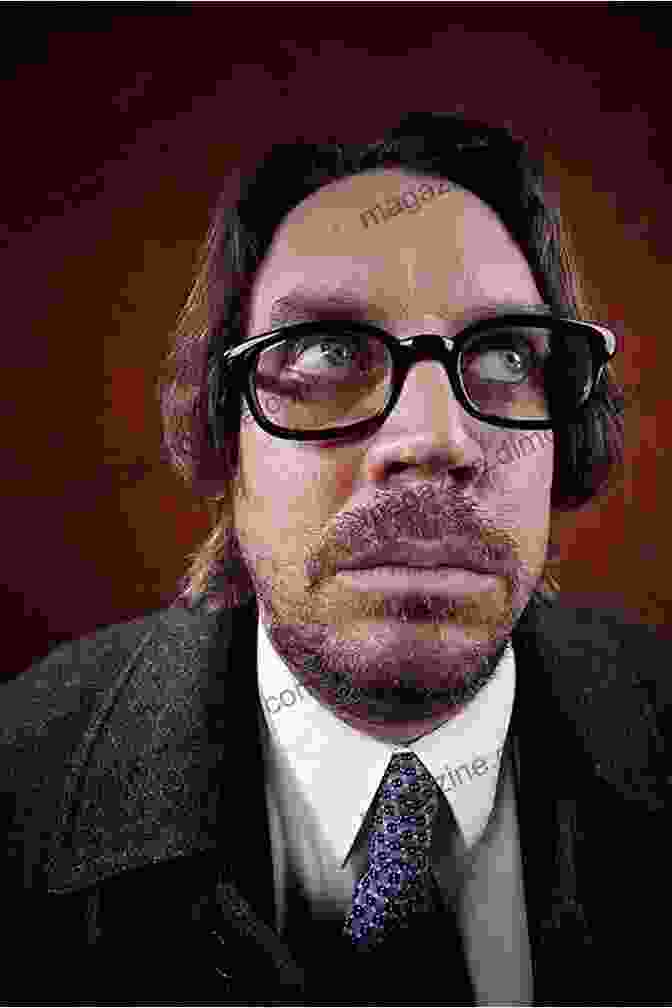 A Black And White Portrait Of Jim Maccracken, A Bespectacled Man With A Serious Expression UNKNOWN X Jim Maccracken