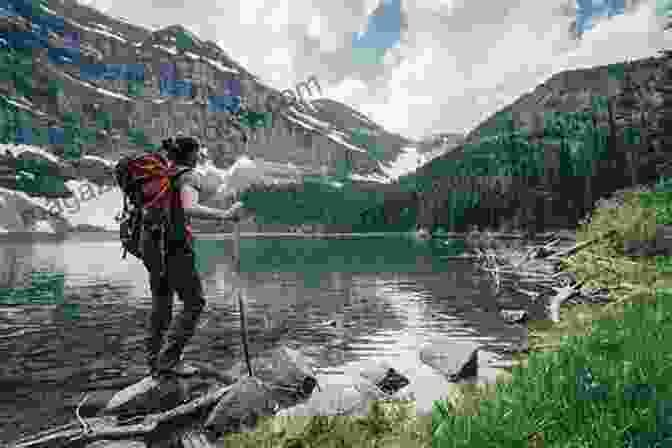 A Hiker Stands Atop A Mountain, Taking In The Panoramic View Of The Lake District. The Cumbria Way: Ulverston To Carlisle Main Route With Mountain Alternatives (Walking Guides)