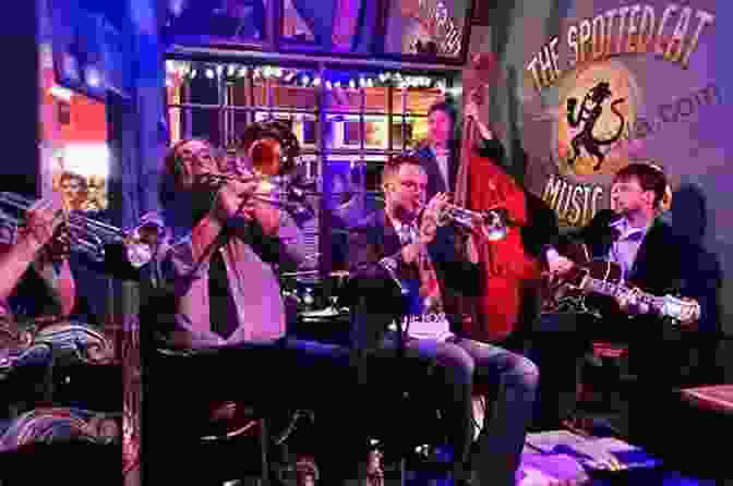 A Live Jazz Performance In A Dimly Lit New Orleans Club, With Musicians On Stage And People Dancing. New Orleans Travel Guide: An Easy Guide To Exploring The Top Attractions Food Places Local Life And Everything You Need To Know