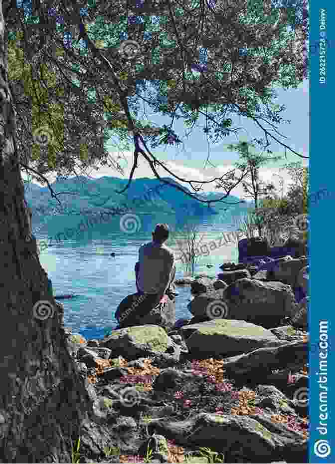 A Man Sits On A Rock, Gazing At A Tranquil Lake Surrounded By Mountains, Contemplating The Beauty Of The Nepalese Landscape 2 Weeks In Nepal Stewart Burton