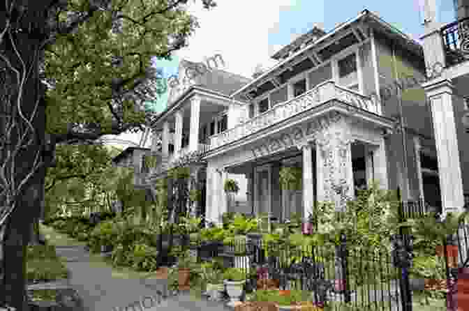 A Stately Mansion In New Orleans' Garden District, With Lush Gardens And Intricate Wrought Iron Balconies. New Orleans Travel Guide: An Easy Guide To Exploring The Top Attractions Food Places Local Life And Everything You Need To Know