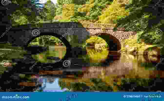 Ancient Stone Bridge Spanning Tranquil River Meandering On Rivers And Canals In Devon (Meandering Walking Series)