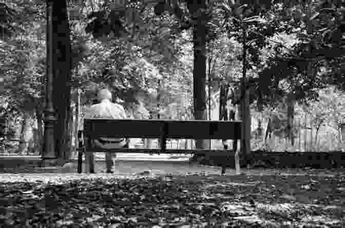 Black And White Photograph Of A Man Sitting On A Bench In A Park, Taken By Joe Salerno Only Here Joe Salerno